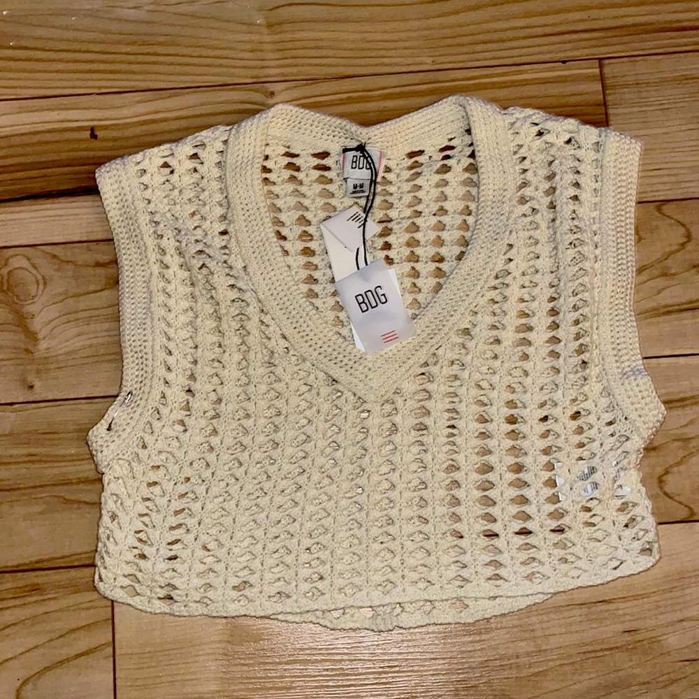 Crocheted, boxy, 90’s cropped vest from Urban Outfitters.